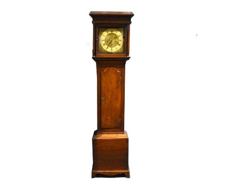 Oak longcase clock, the hood with cavetto moulded cornice, turned columns, trunk with long arched door, bracket feet, eleven 