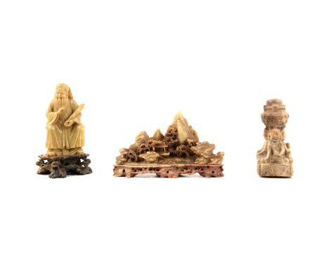 Chinese hardstone carving, seated figure with a scroll, original stand, 16cm, another hardstone carving of a landscape, and a