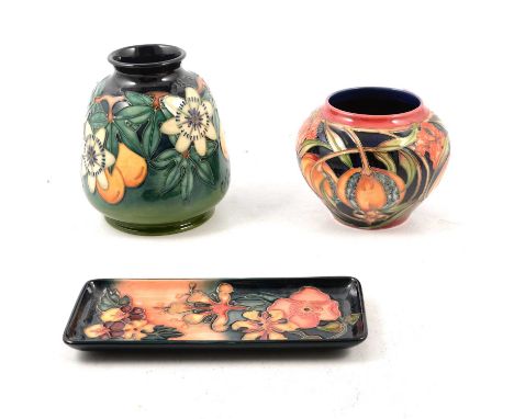 Moorcroft Pottery - two vases, 'Plevrianna' design by Rachel Bishop, 11cm, and 'Passion Fruit', 15cm, and a tray in 'Oberon' 