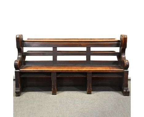 Victorian oak choir stall/ pew, with rear shelf, one scrolled end carved with Gothic tracery panel and quatrefoil, length 183