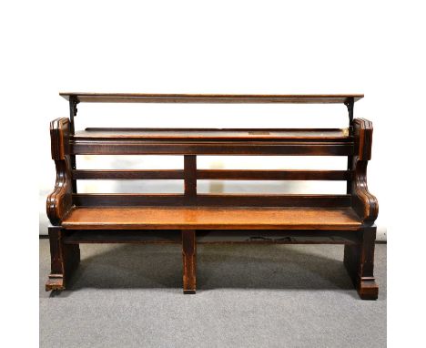 Victorian oak choir stall/ pew, with rear shelf and additional music shelf (removable), the scrolled ends carved with Gothic 