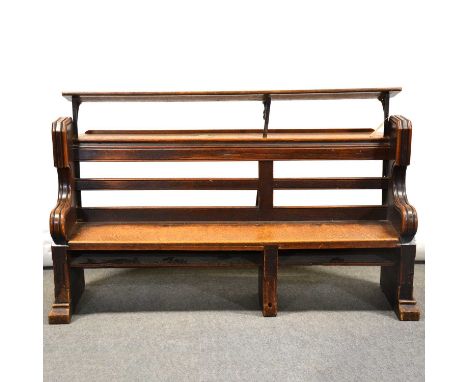 Victorian oak choir stall/ pew, with rear shelf and additional music shelf (removable), the scrolled ends carved with Gothic 