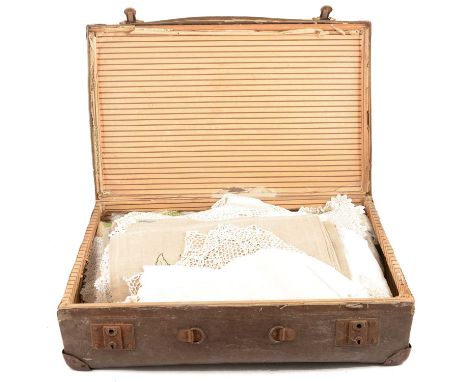 Suitcase containing vintage linen, lace, and embroidered panels