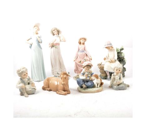 Fifteen Lladro and Nao figurines, including Wheelbarrow Boy, Ghiesha girl, cattle, etc.Condition report:There are no Mandarin