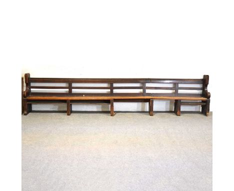 Victorian oak long choir or chapel bench, open back, the scrolled ends carved with tracery panel and small quatrefoil motif, 