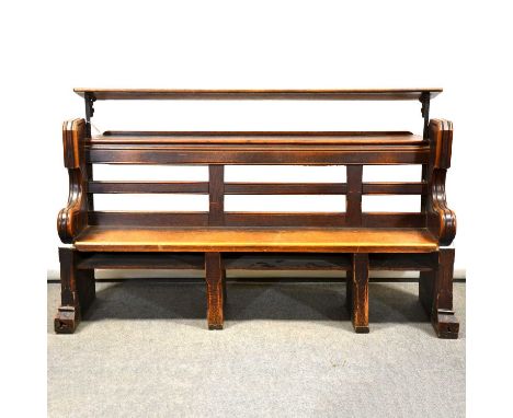 Victorian oak choir stall/ pew, with rear shelf and additional music shelf (removable), the scrolled ends carved with Gothic 