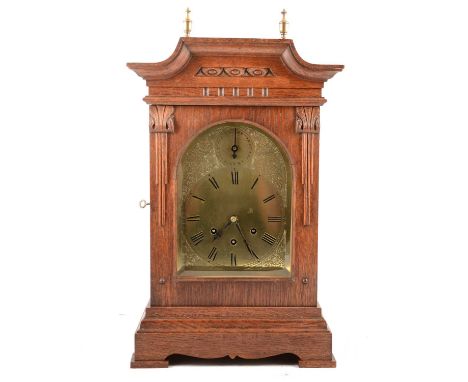 Early 20th century German oak cased mantel clock, Gustav Becker movement striking on five chimes, arched and engraved brass d