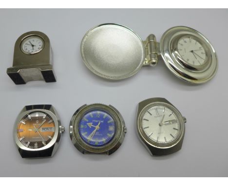 Three wristwatch heads; Interpol, Timex and Revue 