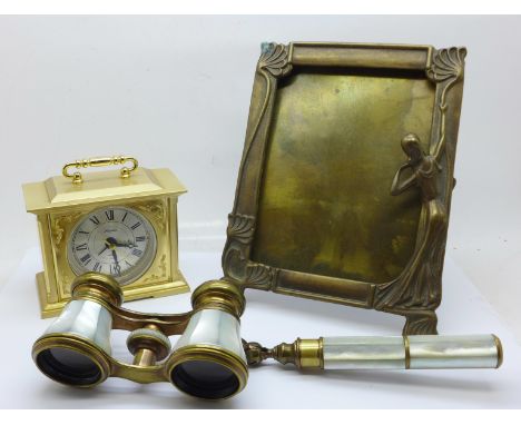 A pair of French brass and mother of pearl opera glasses with handle, marked Monte-Carlo Aix-Les-Bains Medecin Opticien, an A