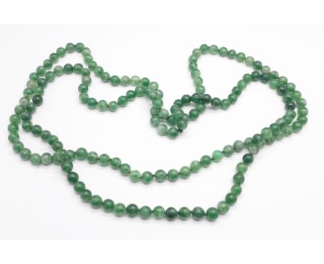 A jade necklace, approximately 125cm 