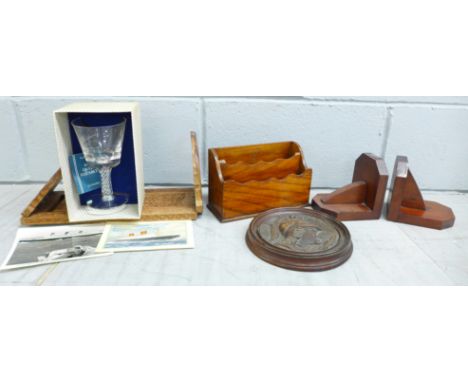 A carved wooden book slide, a pair of wooden book ends, a letter rack, a carved wooden circular plaque of Hermes and a boxed 