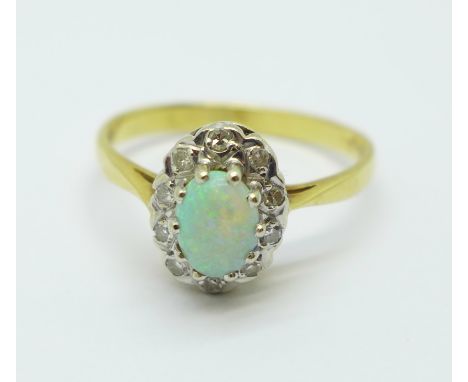 An 18ct gold, opal and diamond cluster ring, 3.3g, R 