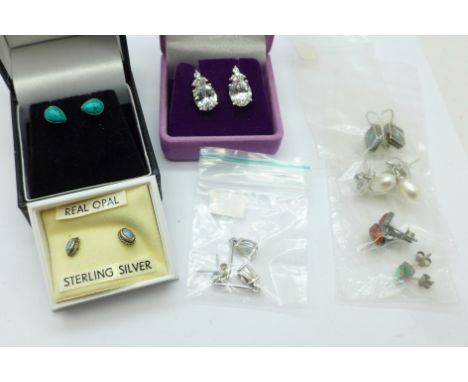 Eight pairs of silver earrings including opal 