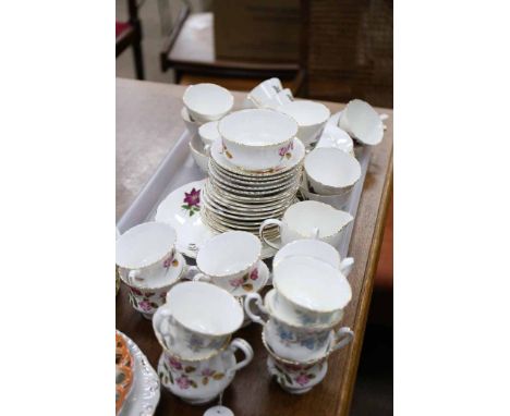 OLD ROYAL BONE CHINA TEA SERVICE
decorated with purple and white flowers on an ivory ground, with gilt highlights; together w