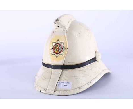 MID-20TH CENTURY WHITE FIRE HELMET
with 'Central Area Fire Service' badge to front, 35cm long