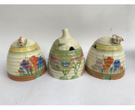 Three Clarice cliff preserve jar and covers , all with faults