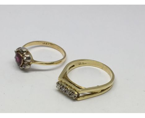 Two 18ct gold stone set rings, a red cluster and a four clear stone example.Approx 7.7g, Q and R