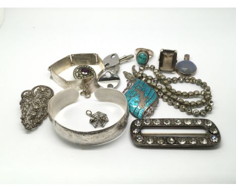 A collection of silver jewellery to include a bangle, pendants and rings.