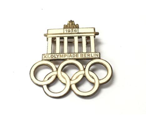 A 1936 Olympic game visitors iron and enamel pin badge.