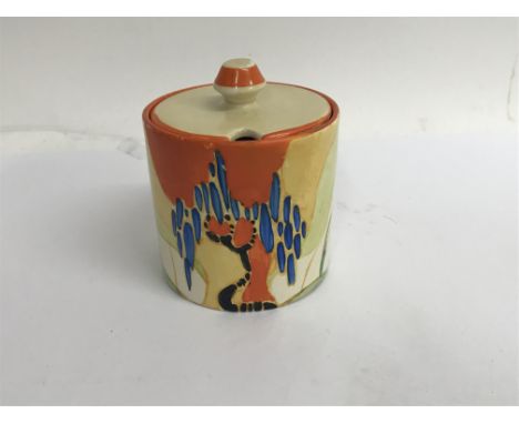 A Clarice cliff preserve jar and cover decorated in the wind bells pattern 8 cm slight paint loss no damage or restoration,