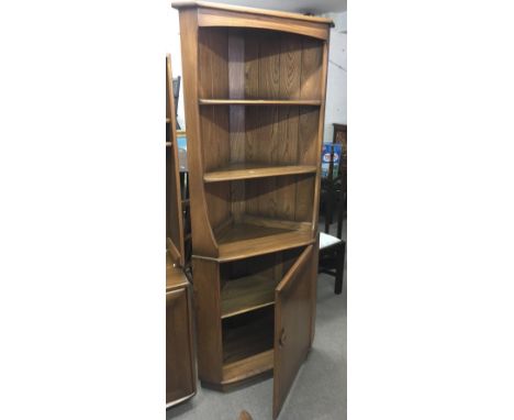 An Ercol corner display cabinet with cupboard base.Approx 74x34cmdx179cm high