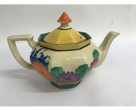 A Clarice cliff tea pot decorated in the gay day pattern , no damage or paint loss
