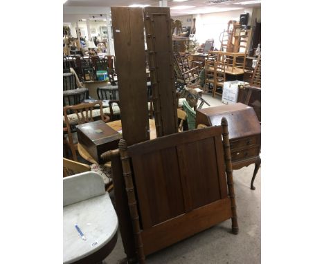 A vintage bed frame with bamboo effect decoration.