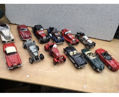 A collection of 1:18 scale diecast model vehicles x12, including Burago