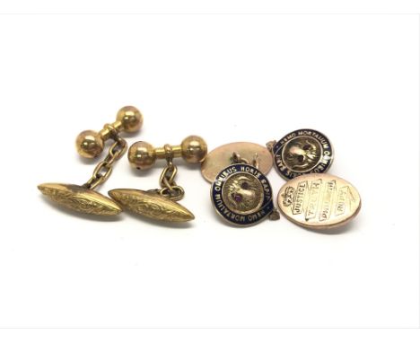 A pair of 9ct gold and enamel cufflinks alongside a second pair of gold cufflinks. Total weight approx 13.3 grams.