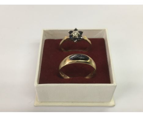 Two gold rings, one 18ct example set with stones approx N-O and a 9ct gold ring, approx size R. Approx 5.41g.