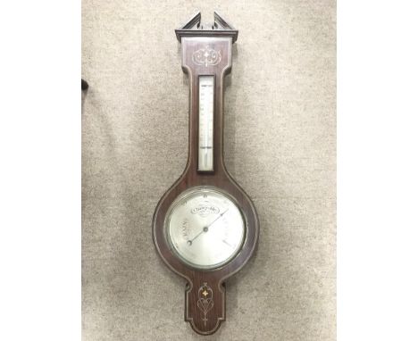 A rosewood, pewter and mother of pearl barometer.