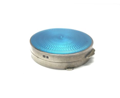 A silver and enamel compact, total weitht approx 45 grams. Maker Cohen and Charles, London.
