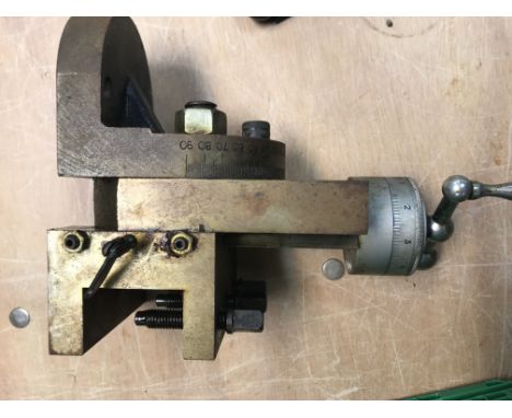 A box contains various tools including lathe chuck, drill bits, multimeter, ARC welder etc
