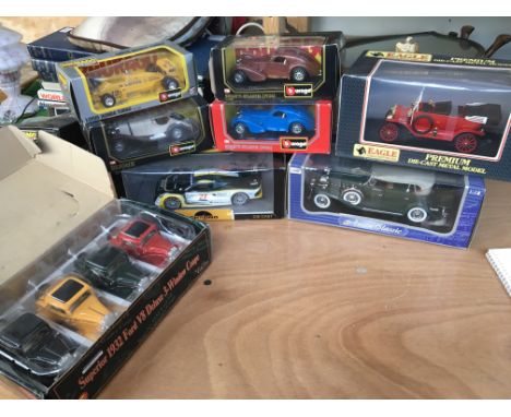 A collection of boxed diecast vehicles including Burago Lotus Honda , Bugatti, Bijoux 1:24 scale and other 1:18 scale boxed d