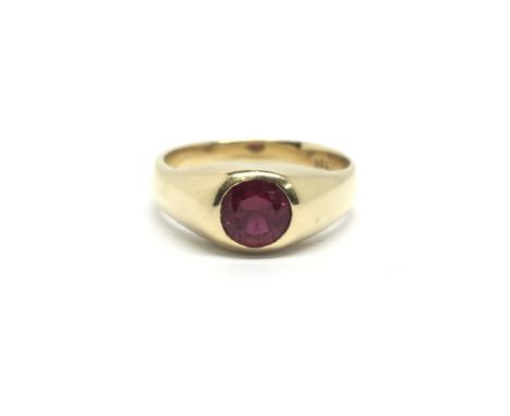 A gents 18ct gold ring set with a large central ruby, total weight approximately 11 grams, ring size V/W.