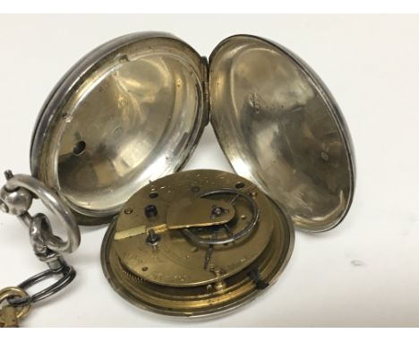 A silver cased hunter pocket watch with an enamel dial. Maker M Bromley Horsham. Watch number 56469.