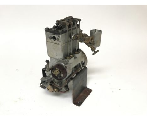 A cast aluminium model of a twin cylinder 2vpc internal combustion OHV engine on metal mount
