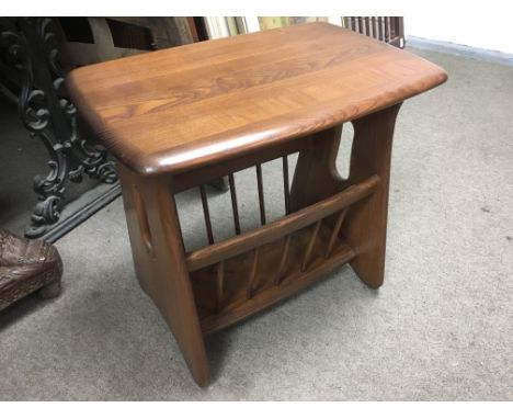 An Ercol Windsor magazine rack.