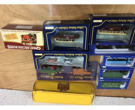 A box of boxed diecast vehicles including 1:76 scale