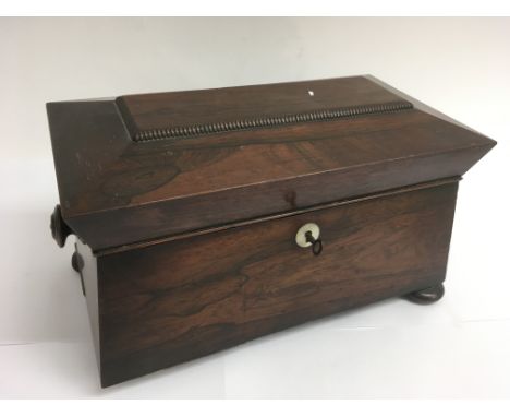 A rosewood tea caddy on bun feet.Approx 18x34cm, lacking one foot