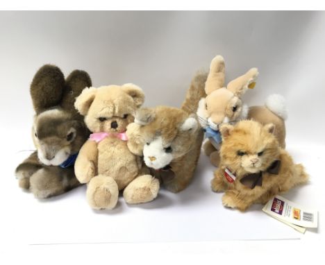 Two Steiff rabbits, two Steiff cats and a possibly Steiff bear.