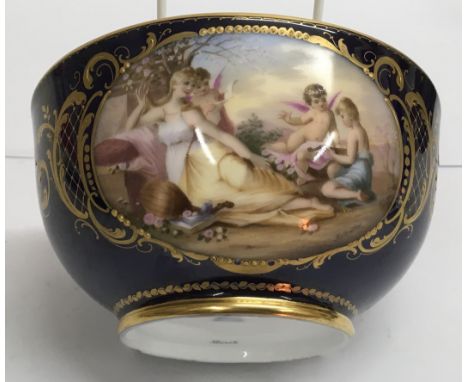 A Vienna 'Musik' porcelain bowl, the colbalt blue ground having painted and gilded reserve panel depicting Classical figures 