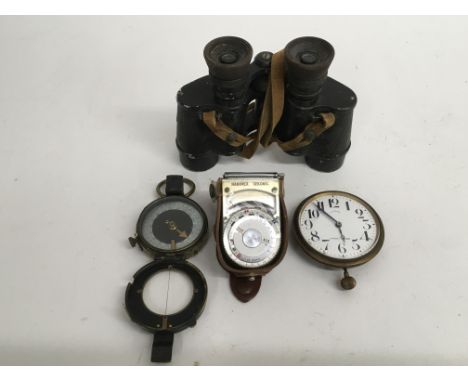 A military compass, pair of binoculars, stopwatch and light meter