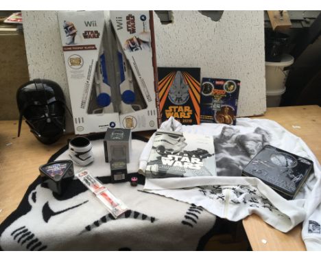 Star Wars collectibles including a Wii blaster gun, an Adidas hooded white top with storm troopers on the reverse , light sab