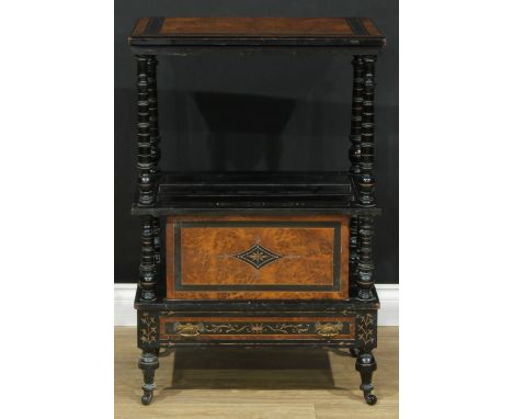 A late Victorian amboyna and ebonised Canterbury whatnot, ring-turned supports, drawer to apron, ceramic casters, 89.5cm high