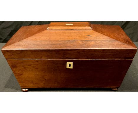 An early Victorian rosewood sarcophagus tea caddy, hinged cover enclosing three lidded compartments, bun feet, 28cm wide, c.1