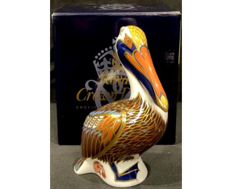 A Royal Crown Derby Brown Pelican paperweight, gold stopper, first quality, boxed 