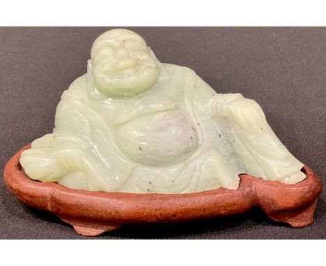 A Chinese jade carving, of Budai, hardwood stand, 15cm wide 