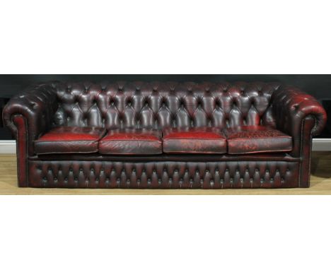 A 'Chesterfield' office reception sofa, deep-button upholstery, squab cushions, 65cm high, 239cm wide, 87cm deep, the seat 18