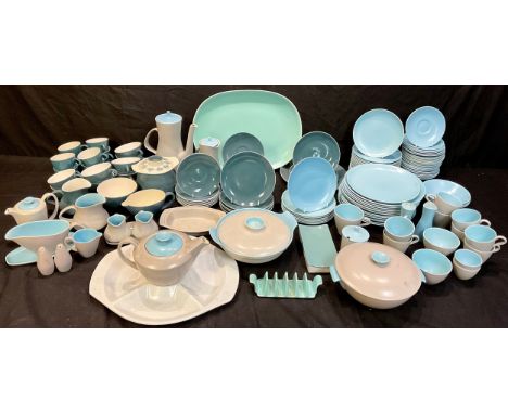 A Poole Pottery twin-tone dinner service comprising vegetable dishes, coffee pot, teapot, jugs, dinner plates, side plates, c